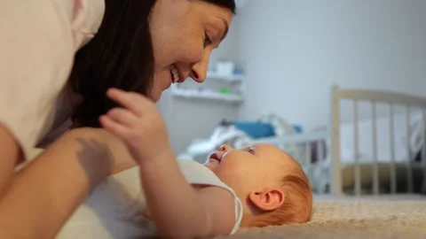 Nanny Plays With Infant On Soft Surface. Soft Mat Activity With Smiling Stock Footage 331200824