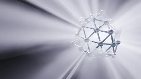 A nanocage structure rotates smoothly as radiant white light rays beam Stock Footage 341679413