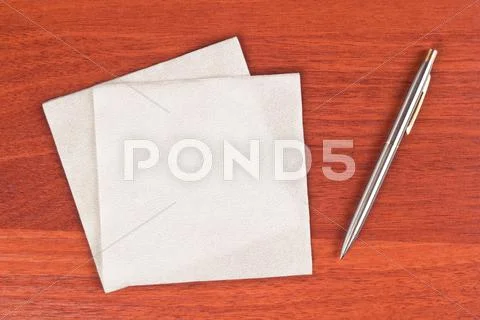 Napkin and pen Stock Photos