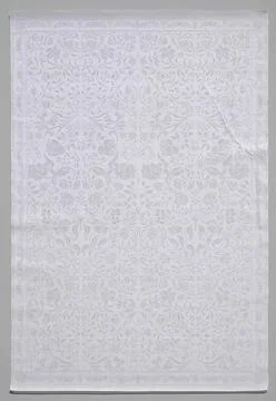 Napkin from white linen damast. White Linen Damask Napkin with a pattern o... Stock Photos