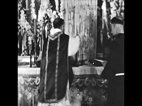 Naples, Italy, 1955 - A priest celebrates Mass on the altar Stock Footage