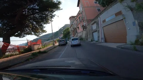 Naples, Italy - August 2, 2023 , Driving a car on the Amalfi Coast roads, drivin Stock Footage 285041335