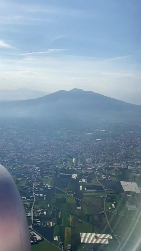 Naples plane Landing: Vertical POV with Vesuvian Horizon and city panorama view Stock Footage 244927366