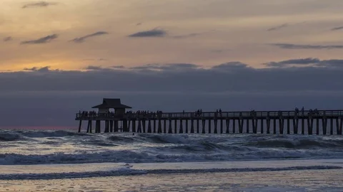 Naples: Sunset at Naples Pier with Waves and People, Wide Stock Footage 76755884