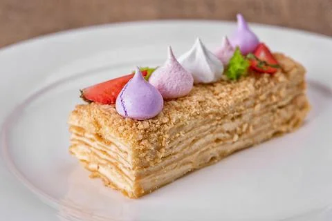 Napoleon cake slice with meringue Stock Photos