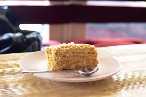 Napoleon cake on the table by the window Stock Photos