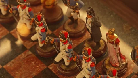 Napoleonic wars themed chess pieces on marble board Stock Footage 334943672