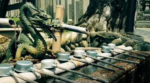 Nara - July 2016: Washing hands in tsukubai, purification fountain at temple. Stock Footage 66257341