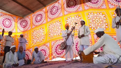 A narration given by man with music called KIRTAN Stock Footage 77192671