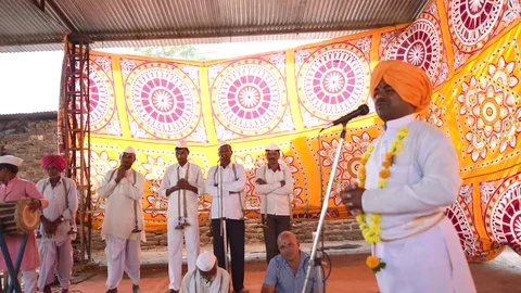 A narration given by man with music called KIRTAN Stock Footage 77192782