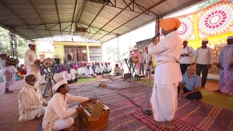 A narration given by man with music called KIRTAN Stock Footage 77192821