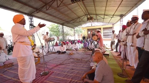 A narration given by man with music called KIRTAN Stock Footage 77192850