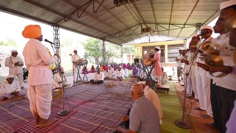 A narration given by man with music called KIRTAN Stock Footage 77192869