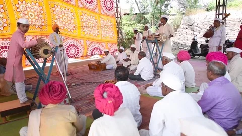 A narration given by man with music called KIRTAN Stock Footage 77192872