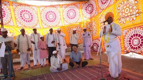 A narration given by man with music called KIRTAN Stock Footage 77192931