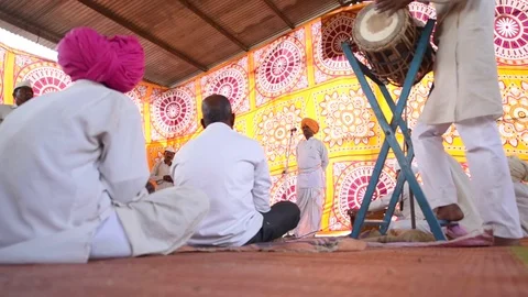 A narration given by man with music called KIRTAN Stock Footage 77192965