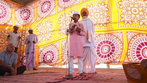 A narration given by man with music called KIRTAN Stock Footage 77192991