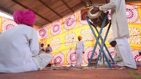 A narration given by man with music called KIRTAN Stock Footage 77192998