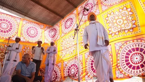 A narration given by man with music called KIRTAN Stock Footage 77193031