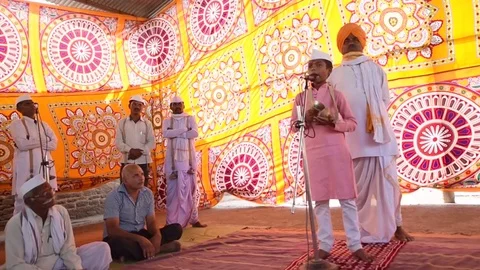 A narration given by man with music called KIRTAN Stock Footage 77193037