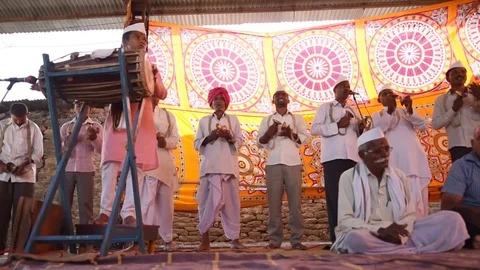 A narration given by man with music called KIRTAN Stock Footage 77193056