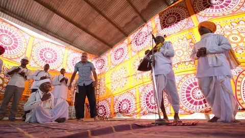 A narration given by man with music called KIRTAN Stock Footage 77193086