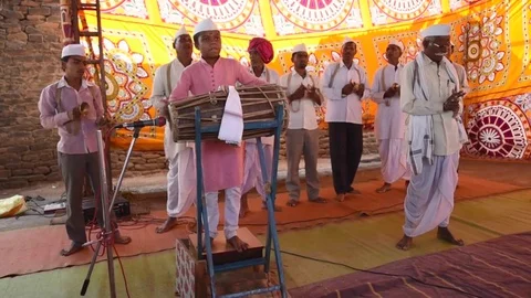 A narration given by man with music called KIRTAN Stock Footage 77193088