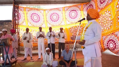 A narration given by man with music called KIRTAN Stock Footage 77223764