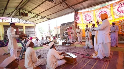 A narration given by man with music called KIRTAN Stock Footage 77223780