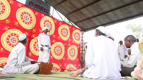 A narration given by man with music called KIRTAN Stock Footage 77396897