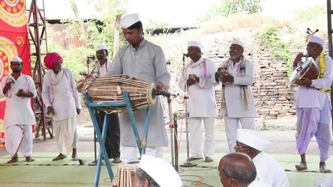 A narration given by man with music called KIRTAN Stock Footage 77397013