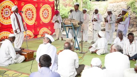 A narration given by man with music called KIRTAN Stock Footage 77397185