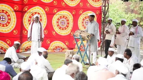 A narration given by man with music called KIRTAN Stock Footage 77397274