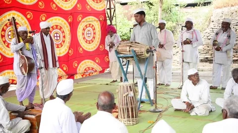 A narration given by man with music called KIRTAN Stock Footage 77397389