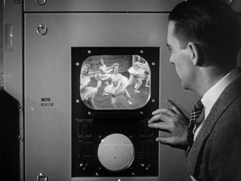 Narrator explains the television programme broadcasting procedure - 1949 動画素材 93690403