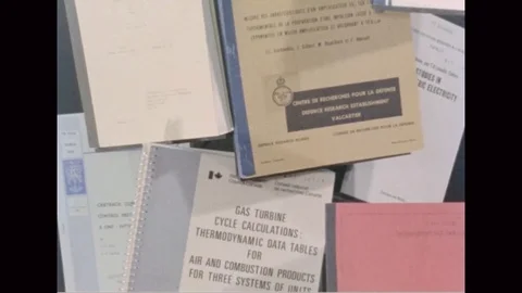 Narrator talks about different books of NASA - 1975 Stock Footage 104333667