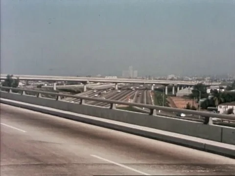 Narrator talks about the freeway system of Los Angeles - 1970 Stock Footage 107361236