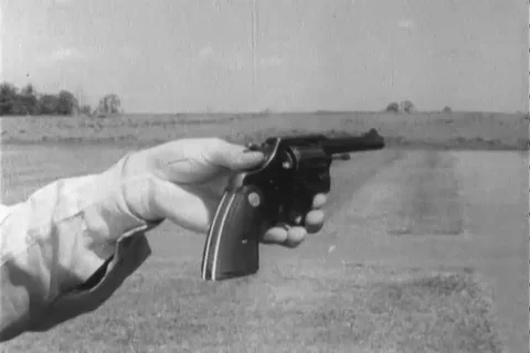 Narrator talks about the right position to handle revolver - 1960 Stock Footage 106067876