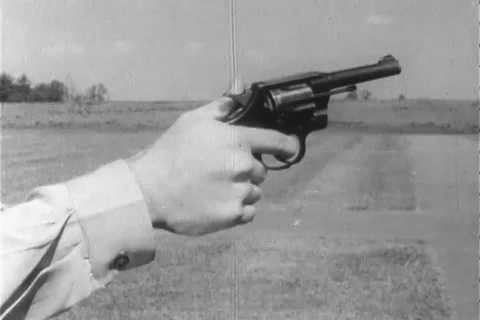 Narrator talks about the right position to handle revolver - 1960 Stock Footage 106067882