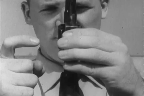 Narrator talks about the right position to handle revolver - 1960 Stock Footage 106067961