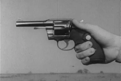 Narrator talks about the right way to handle revolver - 1960 Stock Footage 106068046