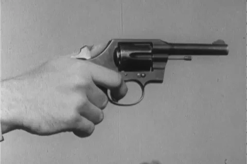 Narrator talks about the right way to handle revolver - 1960 Stock Footage 106068052
