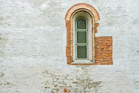 Narrow arched window. Stock Photos