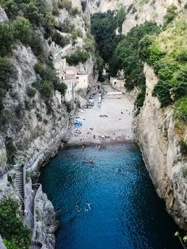 Narrow Beach Between High Cliffs Fjord-Like Stock Photos