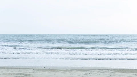 Narrow beach line,Sea waves with wave crashing on sandy shore Stock Footage 112112484
