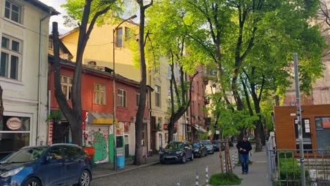 Narrow cobblestone street in Sofia’s Serdika district on a bright spring day in Stock Footage 313575283
