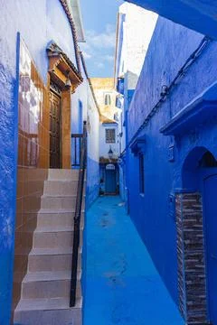 Narrow Corridor of blue reflections on tile Stock Photos