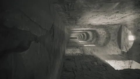Narrow corridor in the old castle. The play of light and shadow Stock Footage 201308636
