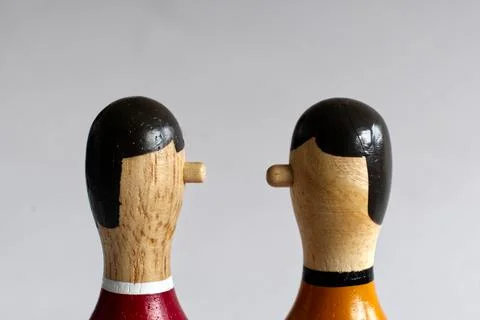 Narrow countershot of a dialogue between two wooden puppets Stock Photos
