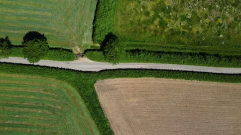 Narrow Country Lane Dividing Patterned Farmland Fields. East Devon Stock Footage 338163880